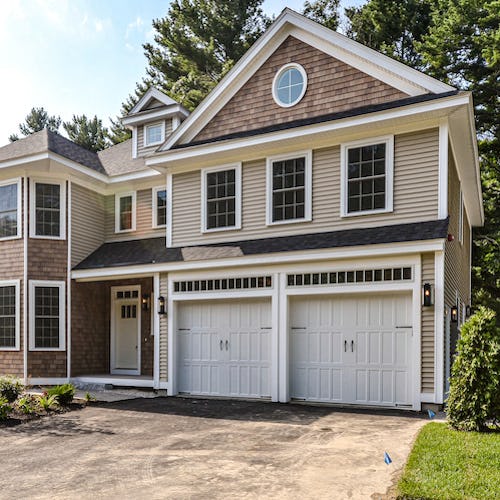 exterior of home with drive under garage>